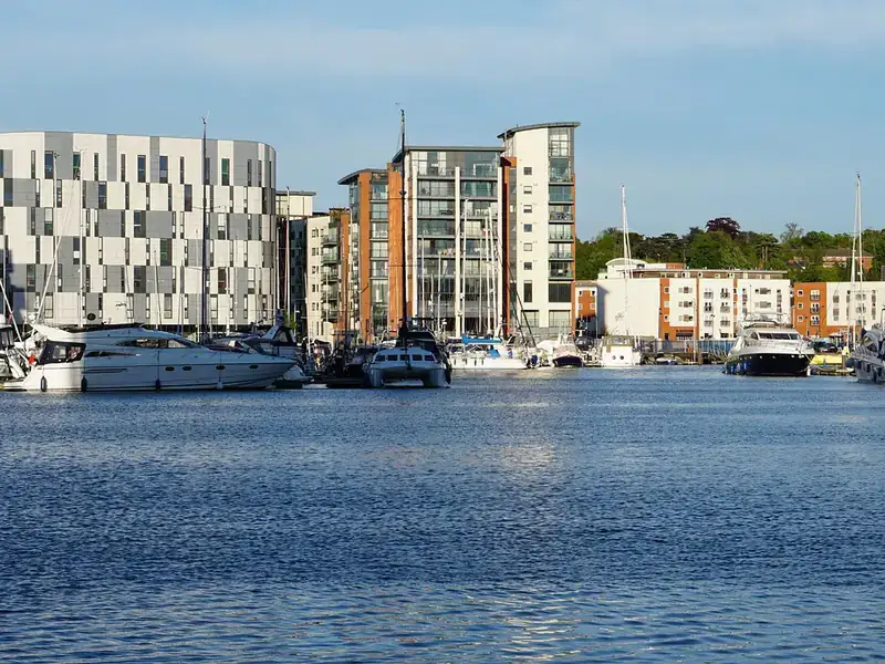 Boats moored in the marina on Ipswich Waterfront, with flats along the quayside